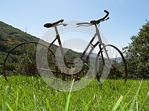 Beautiful photo of a rusty old bicycle and abused photo