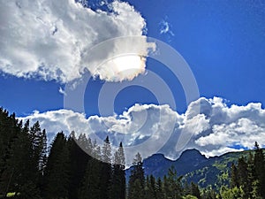 Beautiful photogenic clouds over the Iberig region and slopes of the Schwyz Alps mountain massif, Oberiberg - Canton of Schwyz