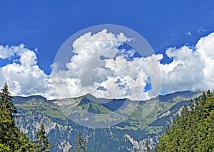 Beautiful photogenic clouds over Lake Brienz Brienzersee and the surrounding alpine peaks - Canton of Bern, Switzerland