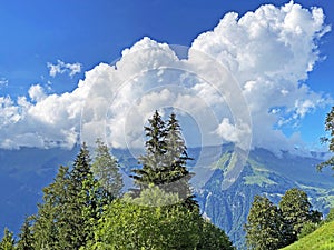 Beautiful photogenic clouds over Lake Brienz Brienzersee and the surrounding alpine peaks - Canton of Bern, Switzerland