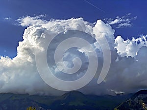 Beautiful photogenic clouds over Lake Brienz Brienzersee and the surrounding alpine peaks - Canton of Bern, Switzerland