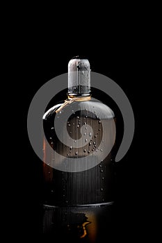 Beautiful photography of black perfume product with water splash