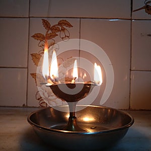 A beautiful picture of ghee lamp also called Diya Indian Traditional photo