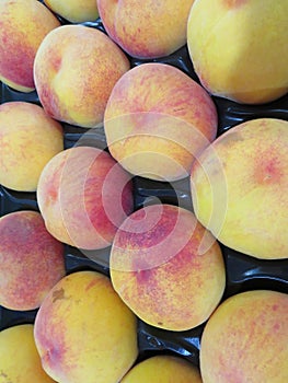 Beautiful picture of mature peaches of great taste and good color photo