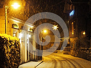 Beautiful picturesque cultural village Hallstat in the evening time at Christmas during snowfall with interesting houses