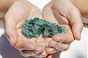 Beautiful piece of Malachite in hands