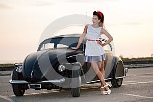 Beautiful pin-up with vintage car