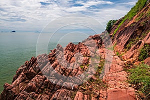 beautiful pink arkosic sandstone or rock cliff by sea, Chanthaburi