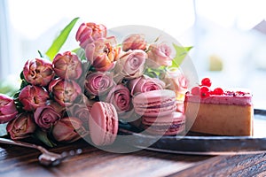 Beautiful pink bouquet of flowers and fine delicacies