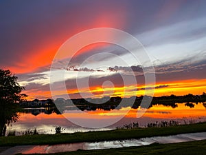 Beautiful pink, orange and blue sunset reflecting on a lake