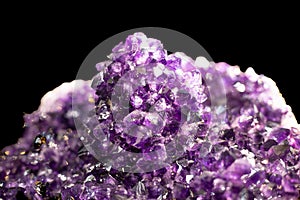 Beautiful pink Quartz Crystal cluster gemstone isolated on black background