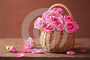 Beautiful pink roses in basket