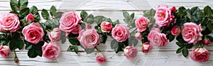 Beautiful Pink Roses Bouquet on White Wooden Background - Top View with Copy Space