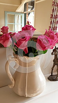 Beautiful pink roses in a cream jug