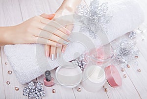 Beautiful pink and silver Christmas manicure with spa essentials