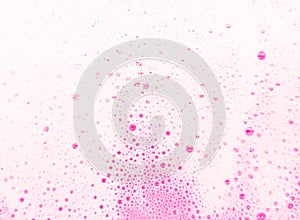 Beautiful pink soap bubbles background, orange and white foam bubble texture