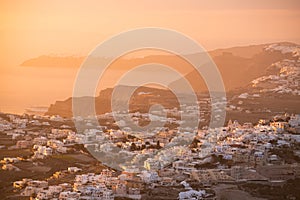 Beautiful pink sunset at Santorini island, Greece. View of Pyrgos village