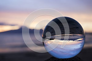 Beautiful Pink Sunset Seascape Captured in Glass Ball