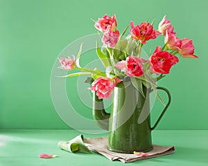 Beautiful pink tulip flowers bouquet in green pot