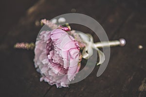 Beautiful pink and white wedding boutonniere with paeony, wedding celebration and valentines day photo