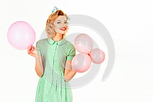 Beautiful pinup girl with pink balloons