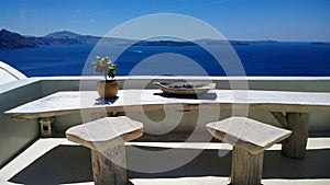 Beautiful place in Oia with a table and chairs for romantic meetings - great view of the bright blue sea