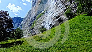 Beautiful places in Switzerland. Waterfall in the mountains. Untouched nature. The sky in the mountains.