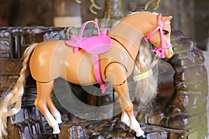 Beautiful plastic toy horse with blonde braided hair