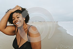 Beautiful plus size African American woman at the beach