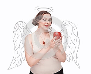 Beautiful plus size woman as angel with apple