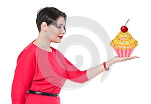 Beautiful plus size woman holding cake on her hand