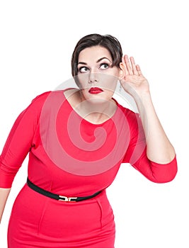 Beautiful plus size woman listening with hand to ear concept