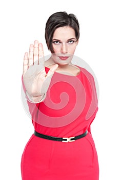 Beautiful plus size woman making stop sign gesture isolated. Focus on hand