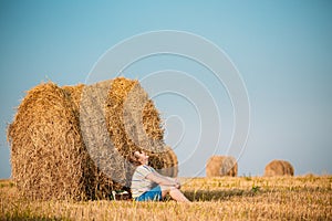 Beautiful Plus Size Young Woman In Shirt Sit Near Hay Bales In S