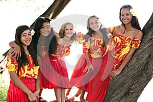 Beautiful Polynesian Hula girls smiling at camera