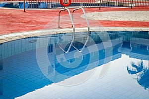 beautiful pool with steps near the sea on nature background