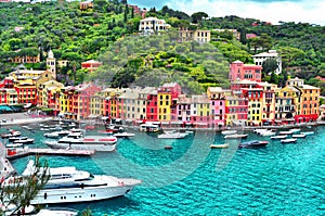 The beautiful Portofino with colorful houses and villas, luxury yachts and boats . Liguria, Italy, Europe