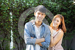 Beautiful portrait couple looking each others eyes and smiling with happy, young asian man and woman relation with love dating