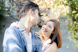 Beautiful portrait couple looking each others eyes and smiling with happy, young asian man and woman relation with love dating