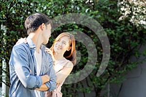 Beautiful portrait couple looking each others eyes and smiling with happy, young asian man and woman relation with love dating