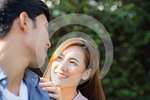 Beautiful portrait couple looking each others eyes and smiling with happy, young asian man and woman relation with love dating