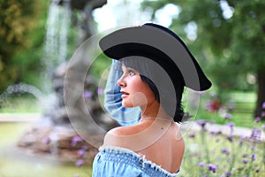 Beautiful portrait of cowgirl with black hat