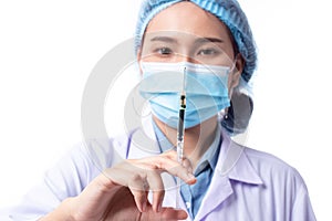 Beautiful portrait friendly asian female doctor or nurse showing medicine syringe  on white background. Healthcare and