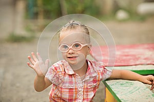 Beautiful portrait of a girl with Down syndrome