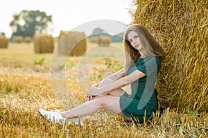 A beautiful portrait of a girl in a green dress.