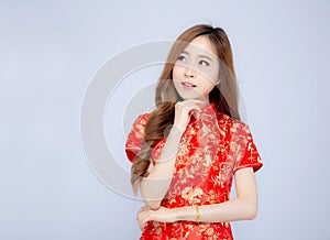 Beautiful portrait happy Chinese New Year young asian woman wear cheongsam fashion think idea 