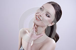 Beautiful portrait with perfect clean skin and make up in studio. hi-quality image.