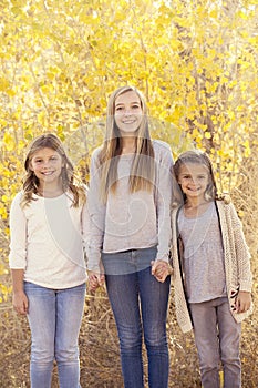 Beautiful Portrait of three little girls outdoors