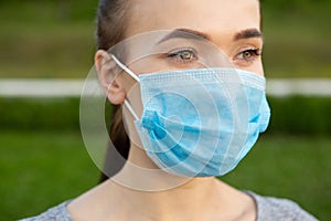 Beautiful Portrait of Woman In A Medical Mask