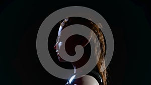 Beautiful portrait of a woman, Side view of the girl. Cold Night light. Steel armor, Realistic 3d render model with dark